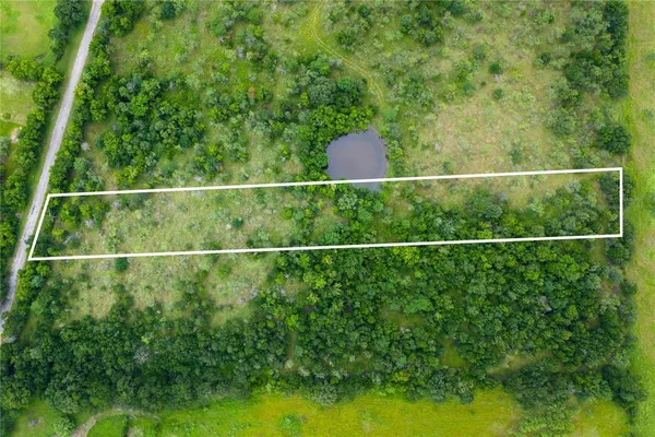 a view of a yard and deck