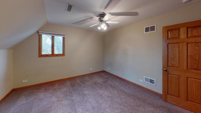1001 Hill Road Geneva, IL 60134 - Photo 22 of 32 an empty room with windows and fan
