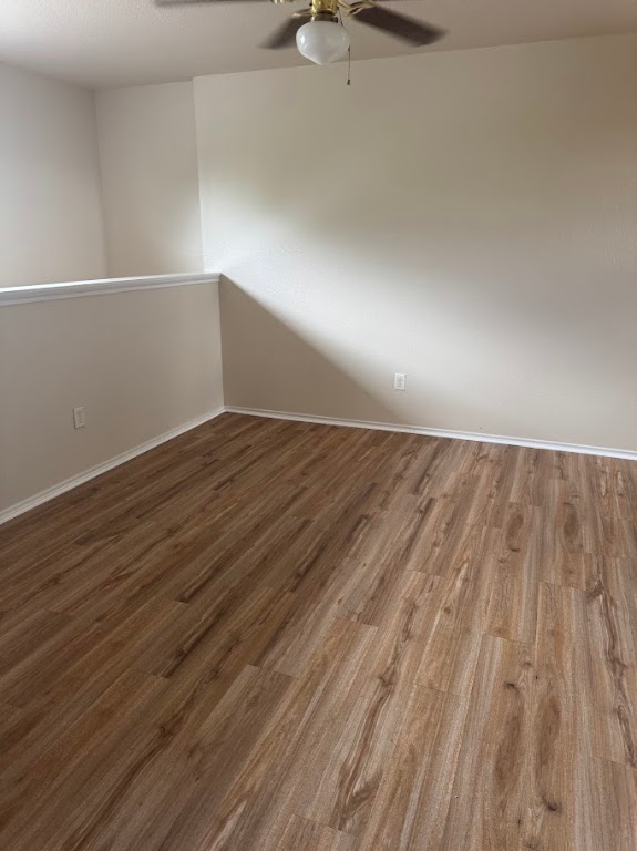 15130 Meredith Lane College Station, TX 77845 - Photo 11 of 16 a view of an empty room with wooden floor