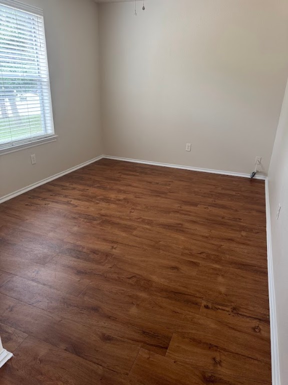15130 Meredith Lane College Station, TX 77845 - Photo 2 of 16 an empty room with wooden floor and windows