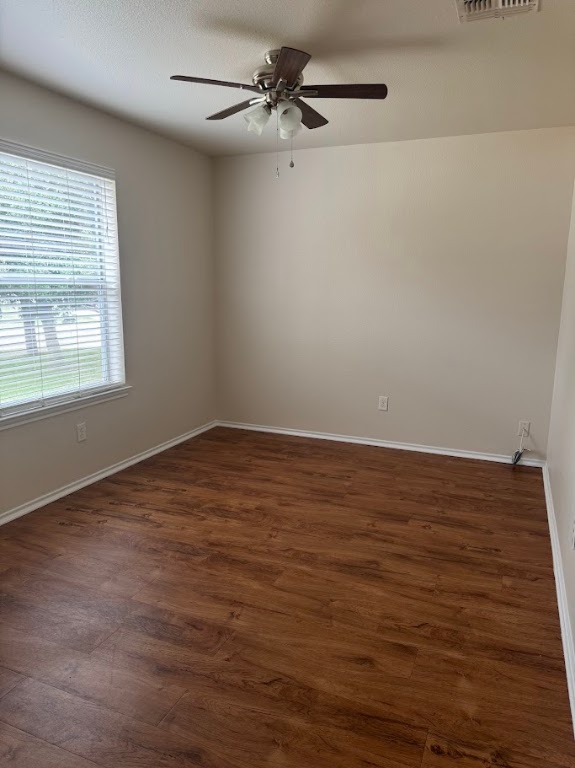 15130 Meredith Lane College Station, TX 77845 - Photo 3 of 16 wooden floor in an empty room with a window