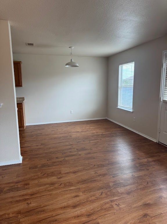 15130 Meredith Lane College Station, TX 77845 - Photo 5 of 16 an empty room with wooden floor and windows