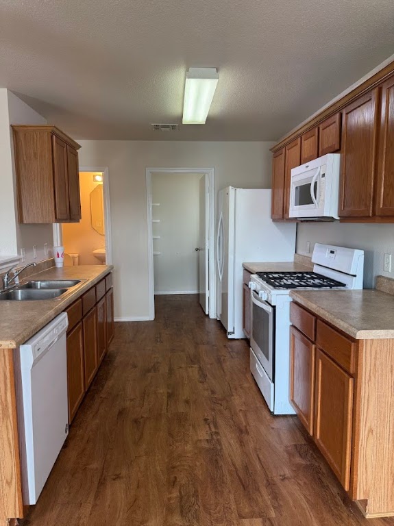 15130 Meredith Lane College Station, TX 77845 - Photo 6 of 16 a kitchen with stainless steel appliances granite countertop a stove a sink and a refrigerator