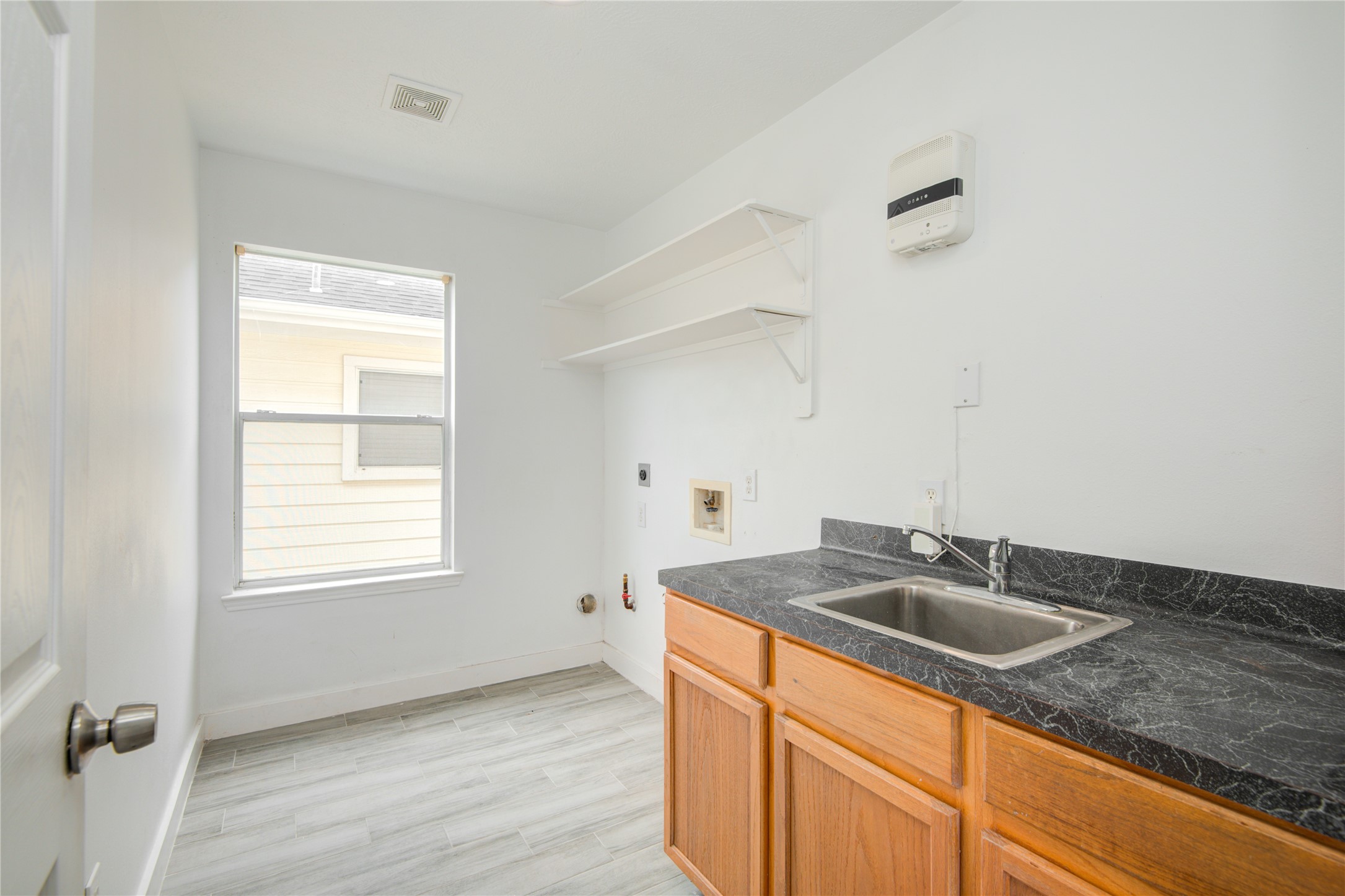 10023 Farrell Drive Houston, TX 77070 - Photo 17 of 26 a kitchen with sink and window