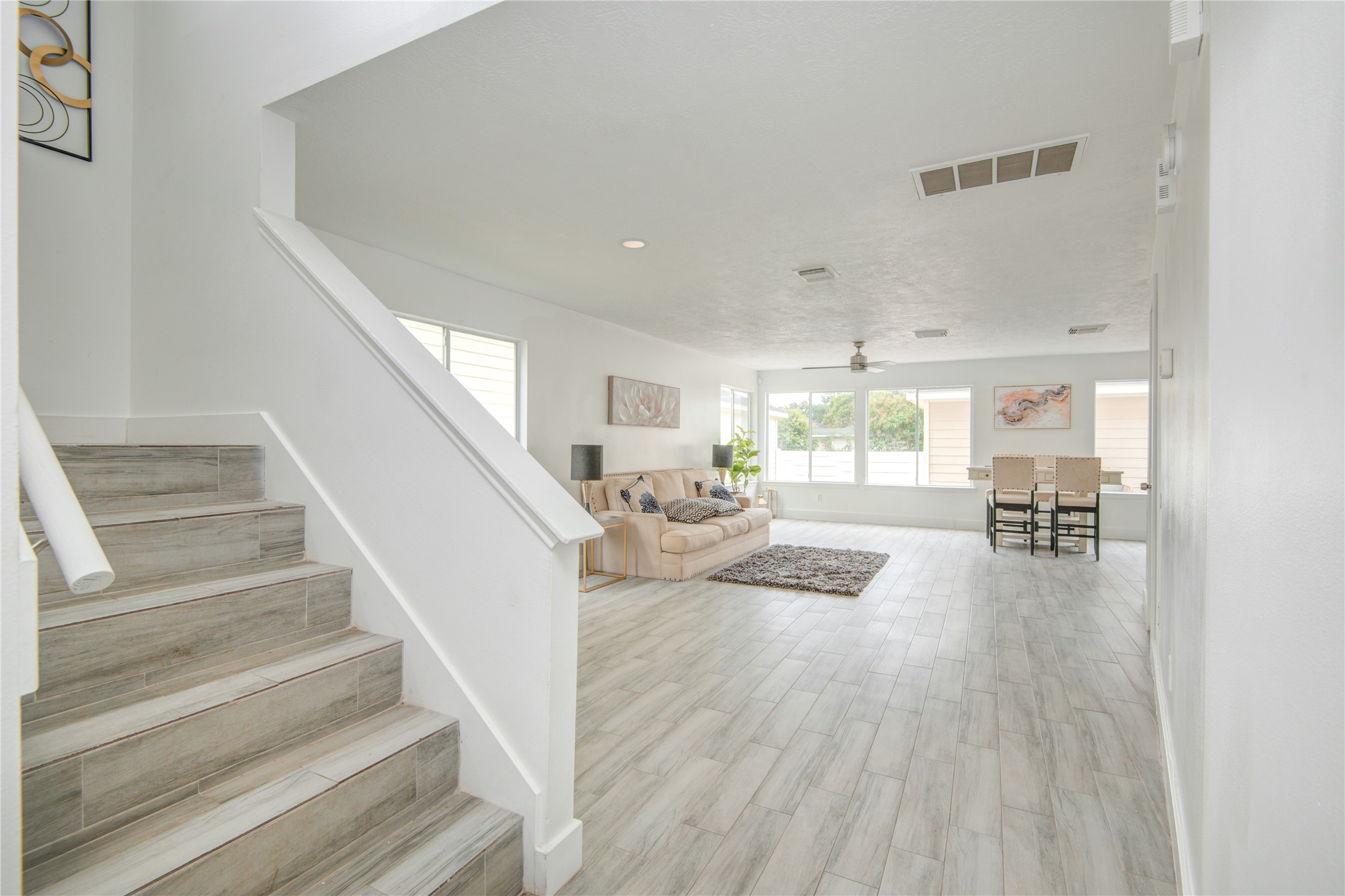 10023 Farrell Drive Houston, TX 77070 - Photo 3 of 26 a view of entryway and livingroom with wooden floor
