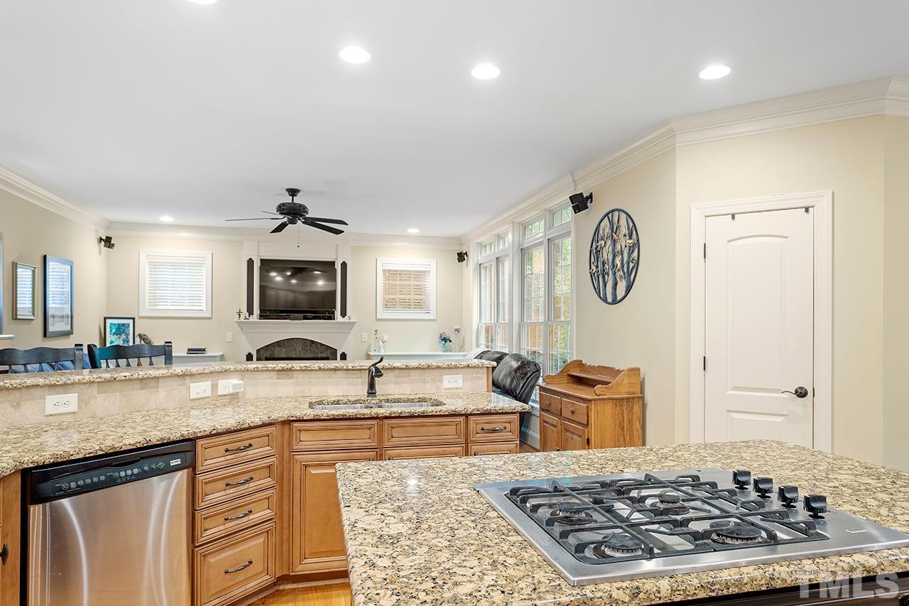 3102 Ringland Road Raleigh, NC 27613 - Photo 16 of 42 a large kitchen with a stove and a sink