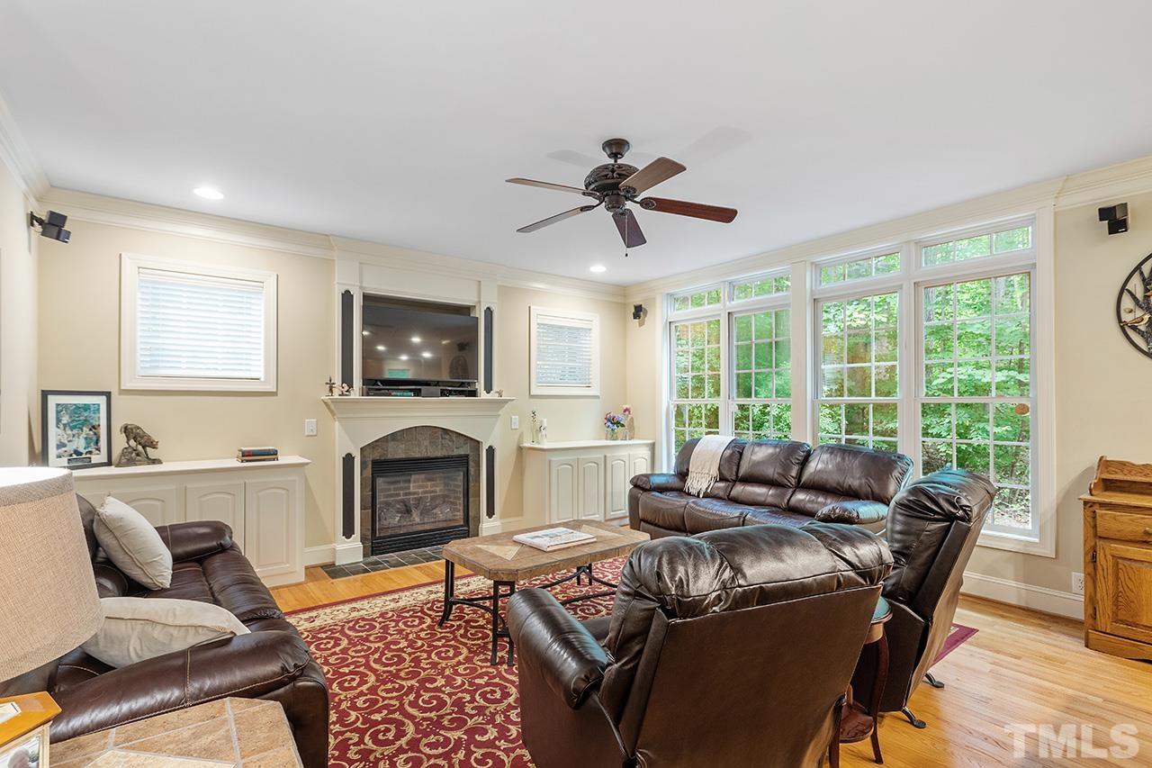 3102 Ringland Road Raleigh, NC 27613 - Photo 18 of 42 a living room with furniture and a fireplace
