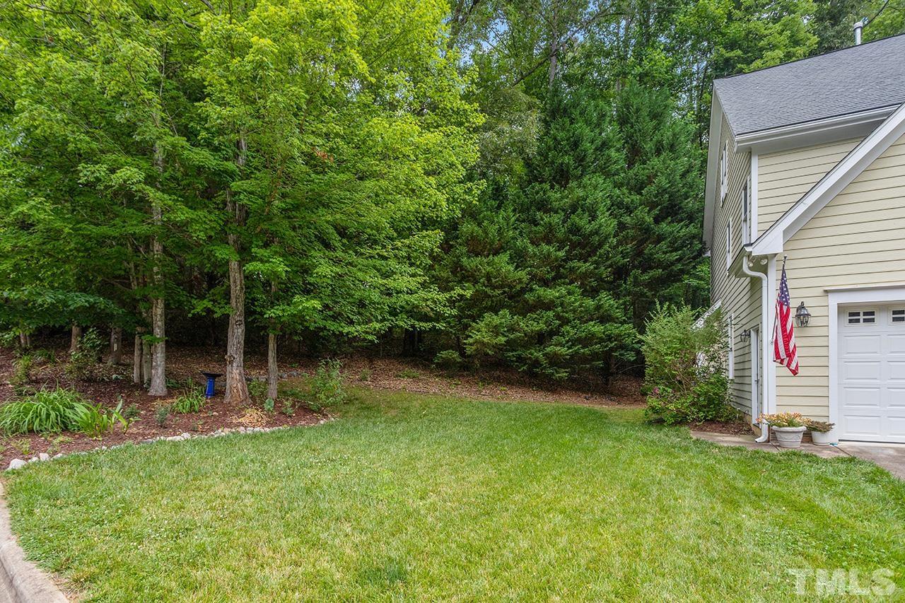 3102 Ringland Road Raleigh, NC 27613 - Photo 42 of 42 a view of a backyard with a small cabin