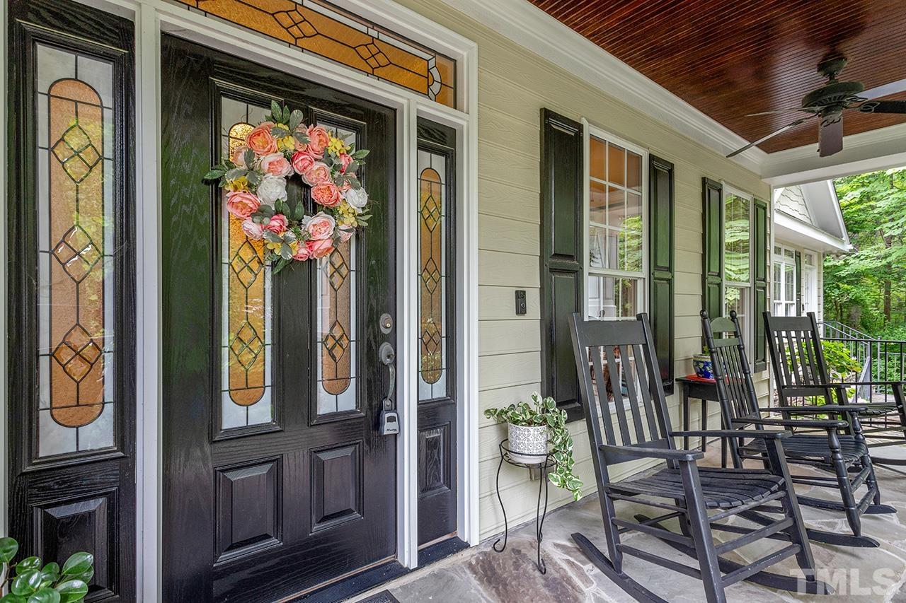 3102 Ringland Road Raleigh, NC 27613 - Photo 5 of 42 a front view of a house with outdoor seating and windows
