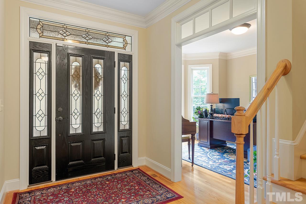 3102 Ringland Road Raleigh, NC 27613 - Photo 6 of 42 a view of entryway with bedroom and wooden floor