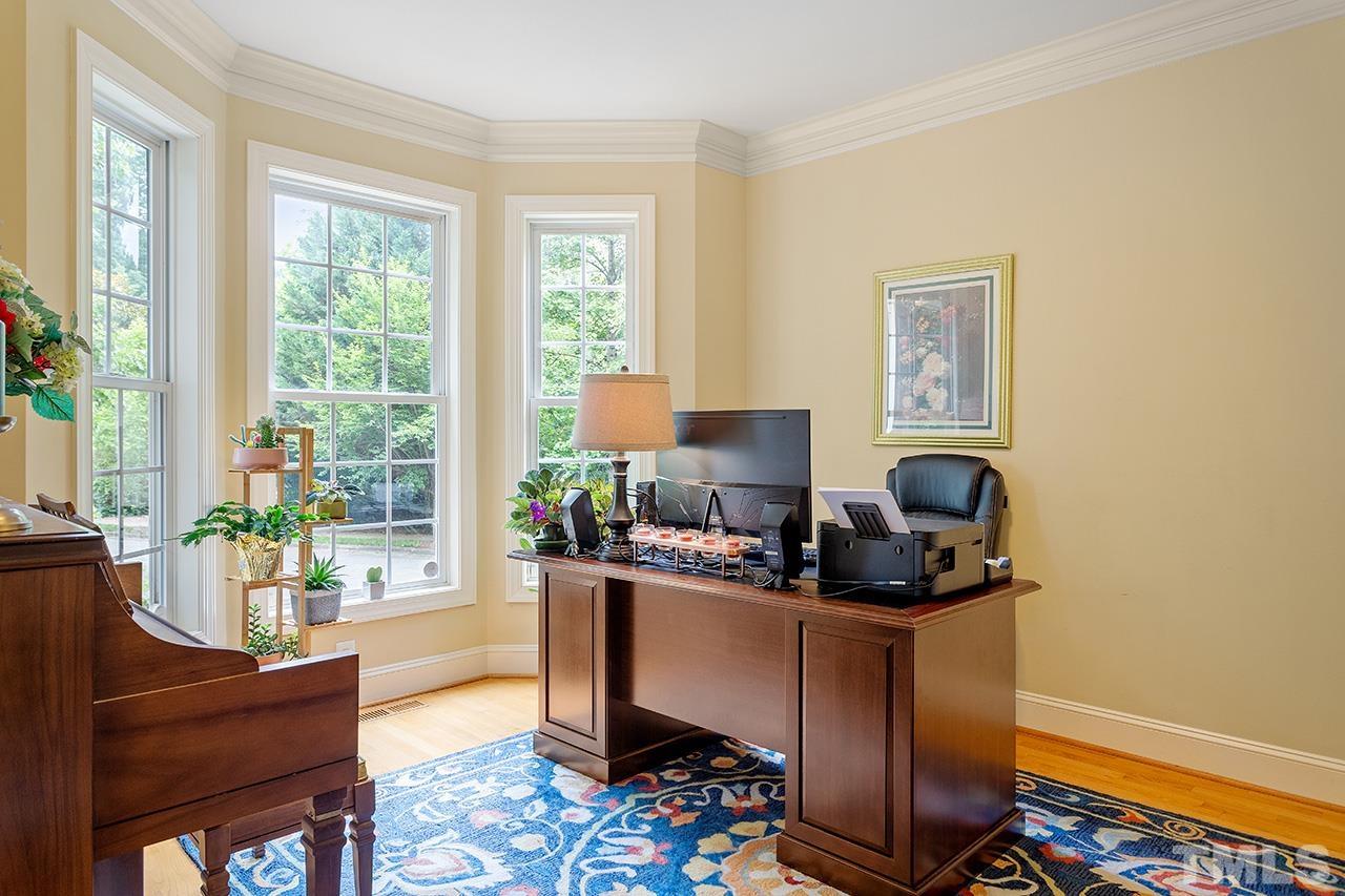 3102 Ringland Road Raleigh, NC 27613 - Photo 8 of 42 a work room with furniture and a window