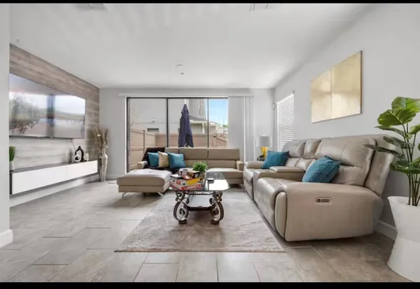 a living room with furniture and a large window