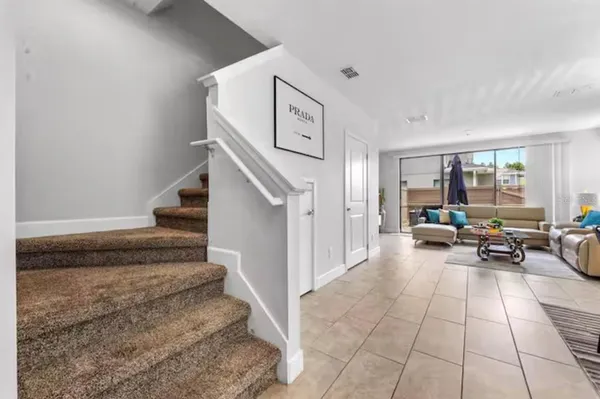 a living room with furniture and a rug