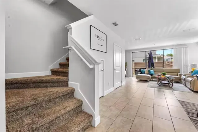 a living room with furniture and a rug