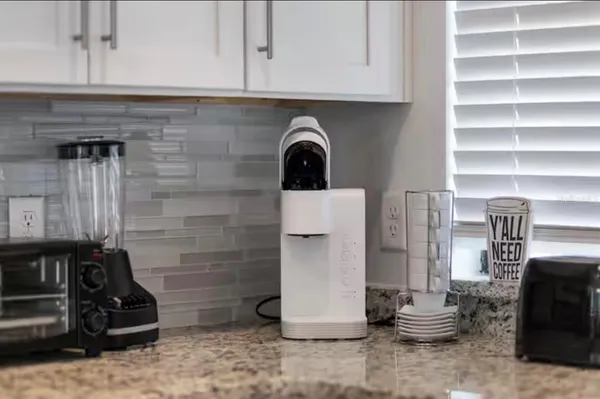 a close view of a stove top oven and cabinets