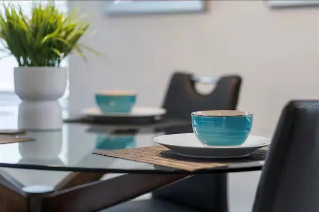 a view of a vase of flowers sitting on a table