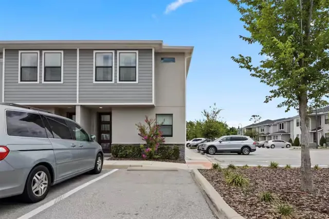 a view of a car parked in front of a house