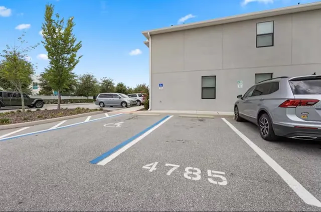 a view of street with parked cars