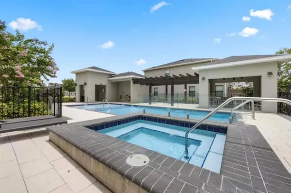 a view of a house with swimming pool and sitting area