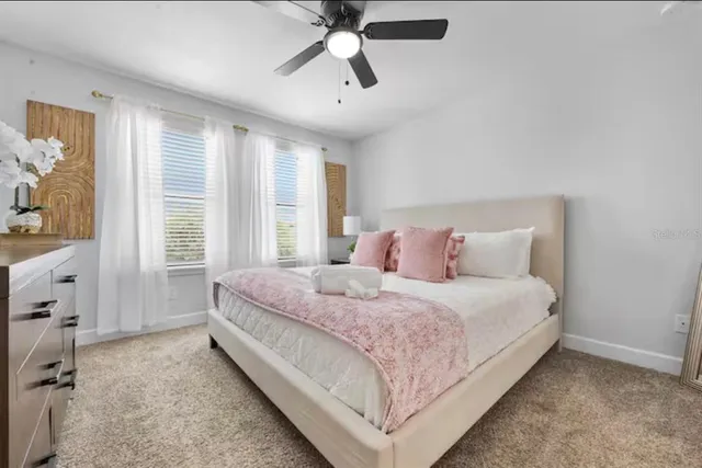 a bedroom with a bed and window