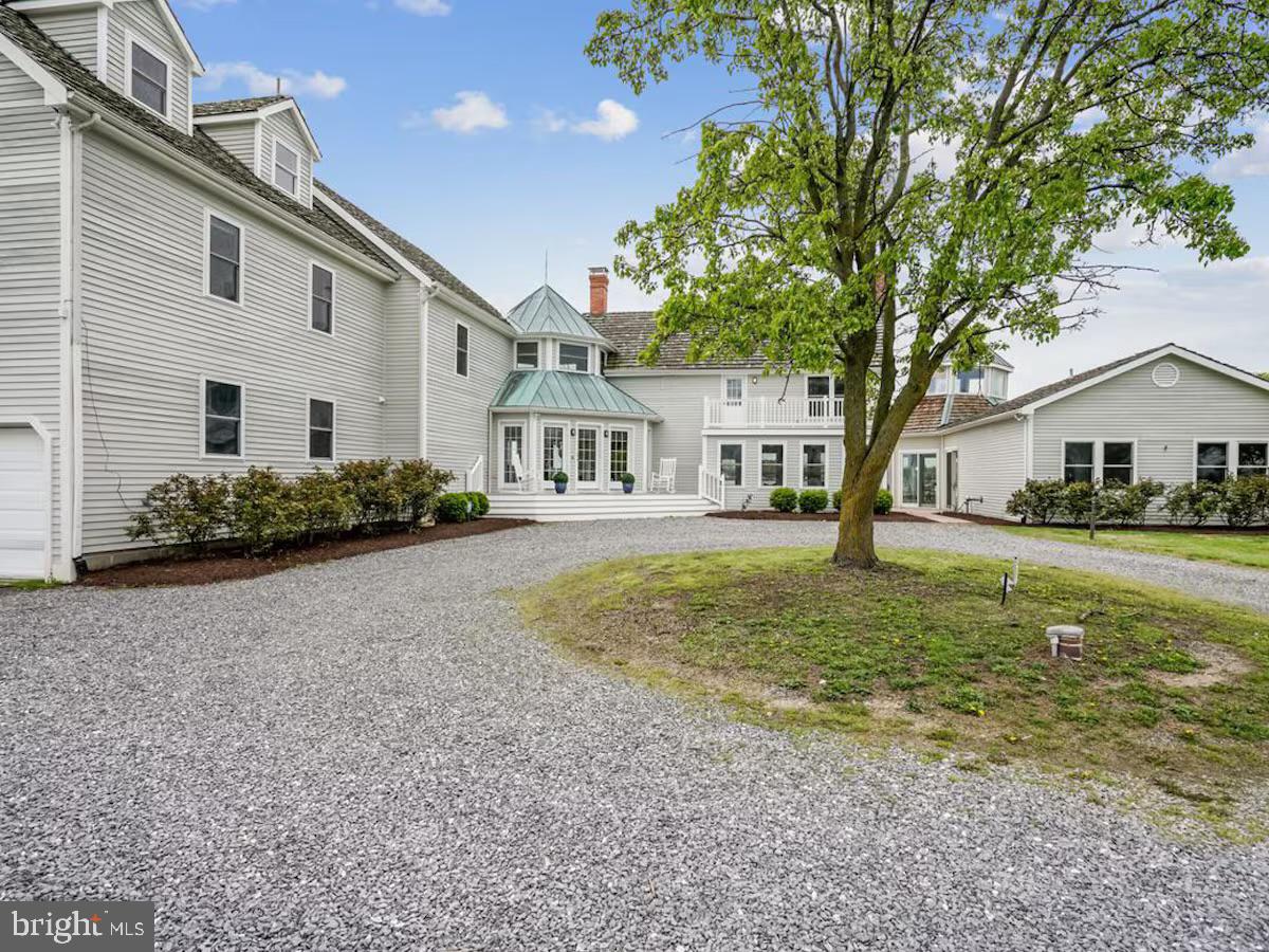21642 Chicken Point Road Tilghman, MD 21671 - Photo 54 of 63 a house view with a garden space