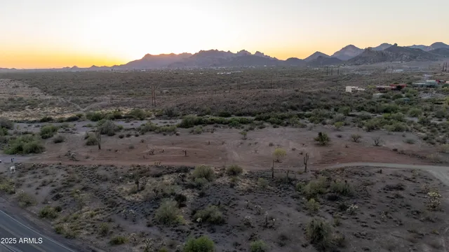 a view of a dry yard with mountain