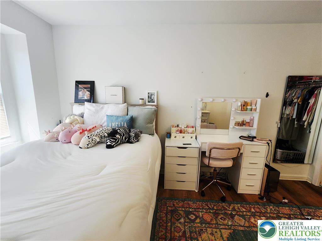 237 Ridings Circle Macungie, PA 18062 - Photo 49 of 70 An inviting bedroom space features warm wood-style flooring and natural light.