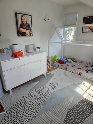 a bedroom with a bed and cabinets
