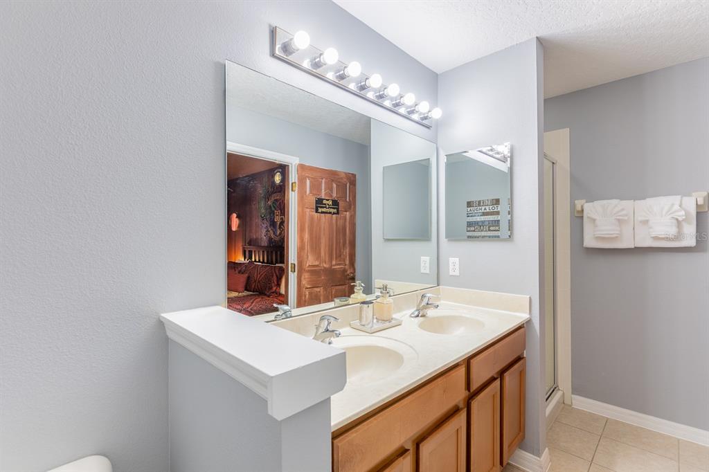891 Assembly Court Reunion, FL 34747 - Photo 25 of 54 a bathroom with a sink and a mirror