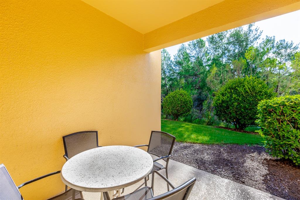891 Assembly Court Reunion, FL 34747 - Photo 31 of 54 a view of a chairs and table in the patio