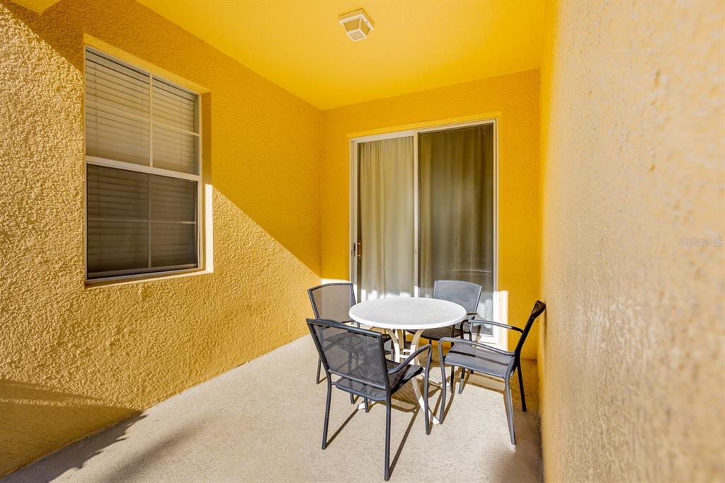 891 Assembly Court Reunion, FL 34747 - Photo 32 of 54 a view of a dining room with a table and chairs