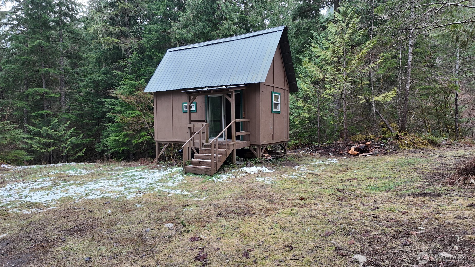 64084 Cascade River Road, Unit D1204 Marblemount, WA 98267 - Photo 4 of 26 a aerial view of a house with a yard and trees