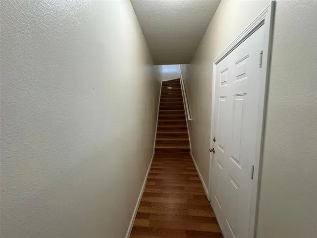 a view of a hallway with stairs