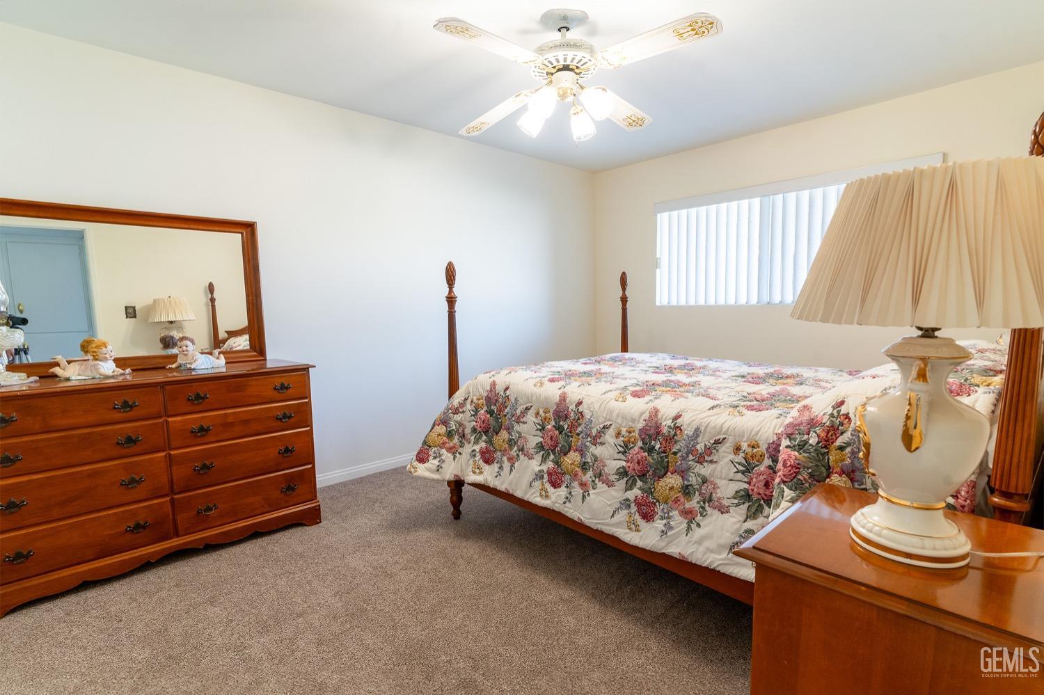 Undisclosed Address Bakersfield, CA 93308 - Photo 14 of 18 a bedroom with a bed and wooden floor