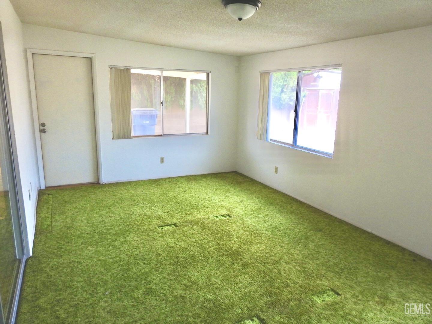 Undisclosed Address Bakersfield, CA 93308 - Photo 15 of 18 a view of an empty room with a window