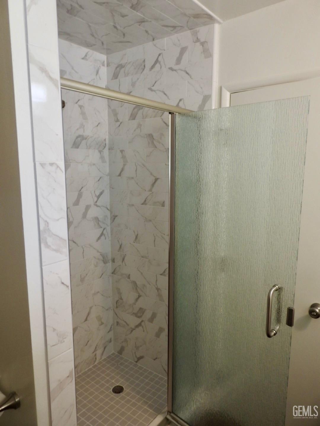 Undisclosed Address Bakersfield, CA 93308 - Photo 8 of 18 a bathroom with a shower
