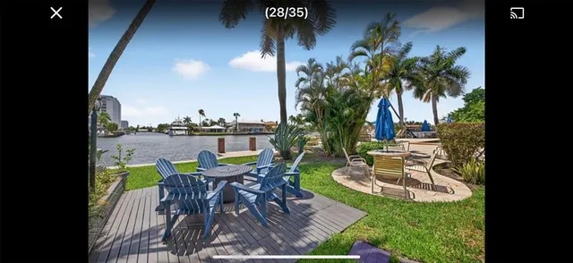 a view of a chairs and table in patio