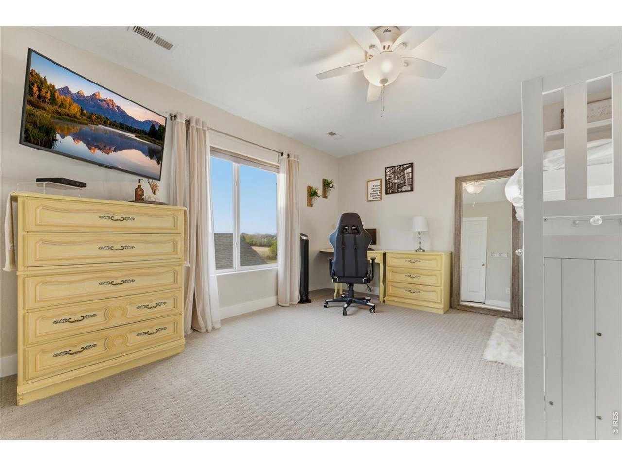 1148 Wagon Bend Road Berthoud, CO 80513 - Photo 24 of 50 a view of room with furniture and a flat screen tv