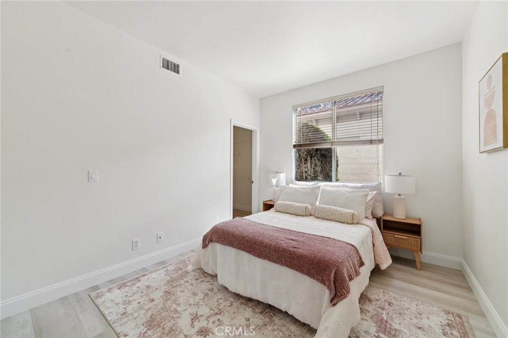 12440 Butler Way Tustin, CA 92782 - Photo 16 of 65 First floor bedroom. Closet entry door on the left.