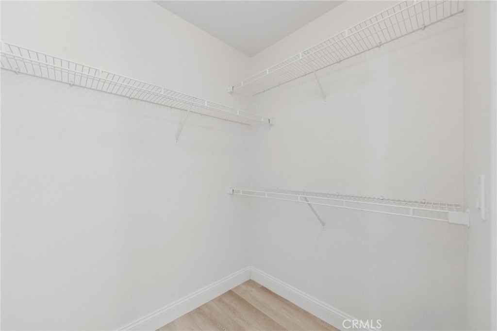 12440 Butler Way Tustin, CA 92782 - Photo 18 of 65 First level bedroom closet has lots of hanging storage.