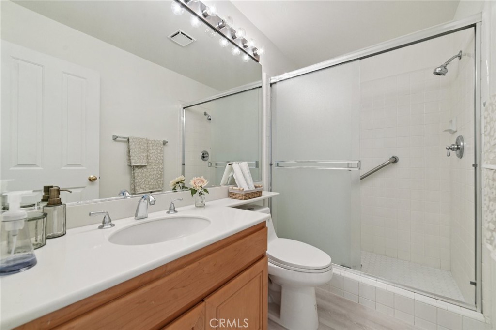 12440 Butler Way Tustin, CA 92782 - Photo 19 of 65 First level full bath is next to the bedroom.