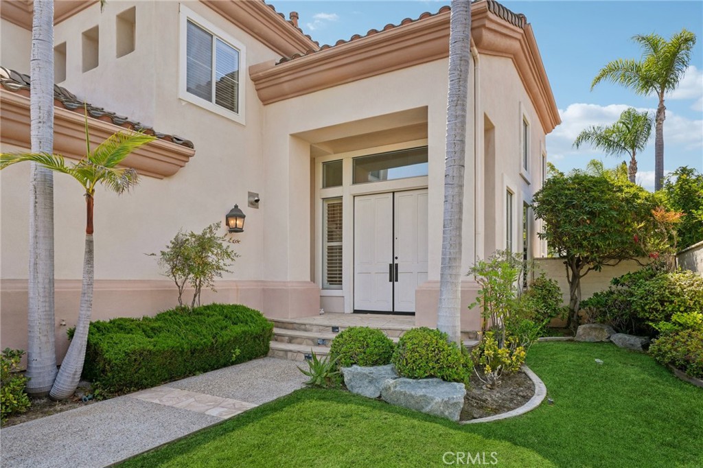 12440 Butler Way Tustin, CA 92782 - Photo 3 of 65 View of the covered entryway. Entering through the double front doors lead into the spacious living room and formal dining area.