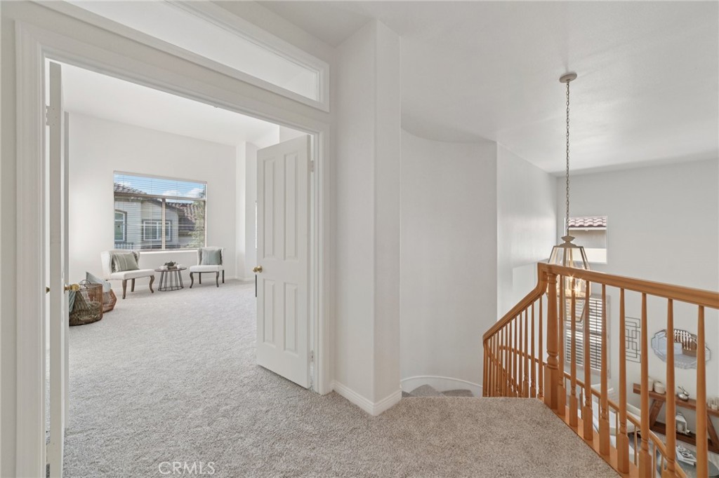 12440 Butler Way Tustin, CA 92782 - Photo 33 of 65 Double door entry into the primary bedroom at the top of the stairway.