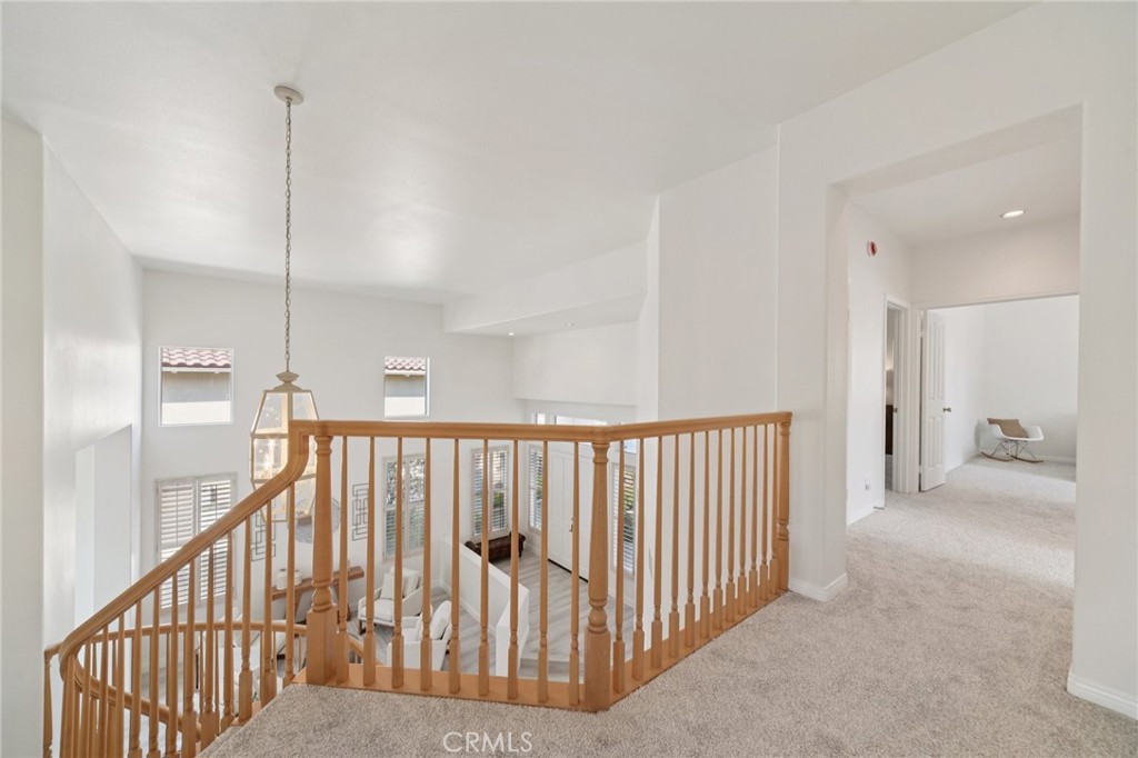 12440 Butler Way Tustin, CA 92782 - Photo 34 of 65 View at the top of the stairway looking towards the additional bedrooms and bonus room.