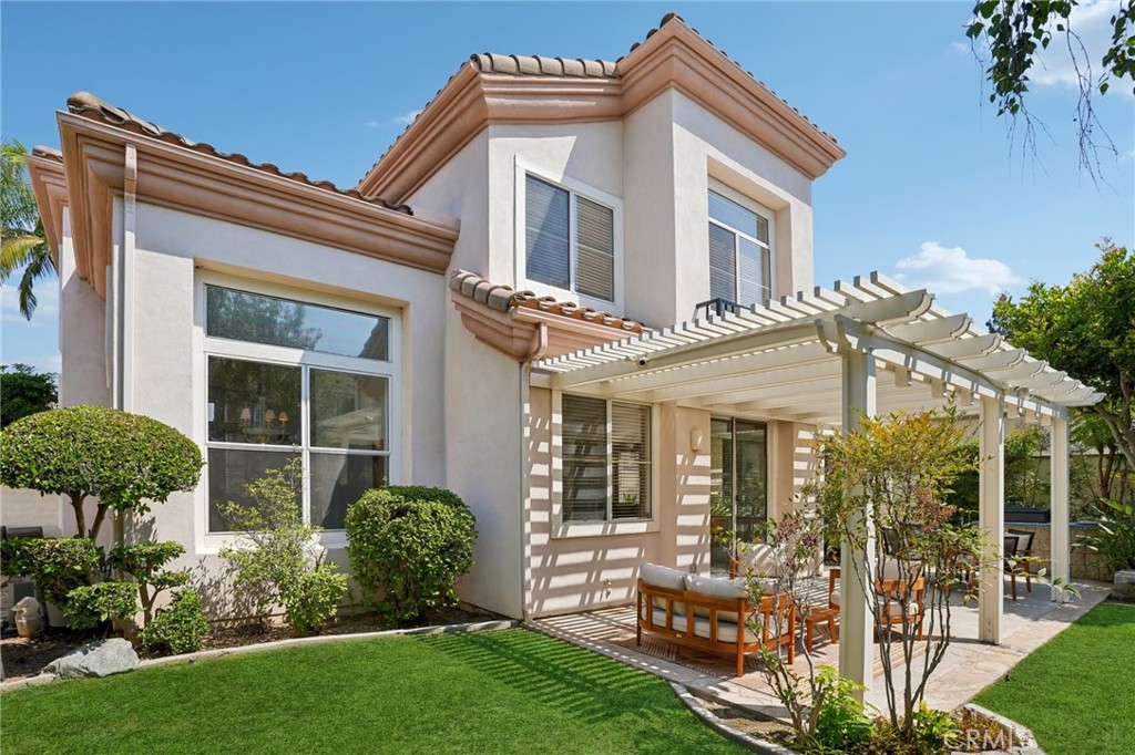 12440 Butler Way Tustin, CA 92782 - Photo 42 of 65 Back yard view with garden area on the left of the house.