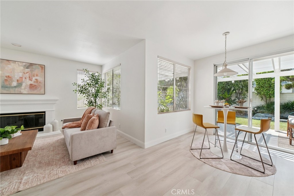 12440 Butler Way Tustin, CA 92782 - Photo 7 of 65 View of family room on the left with breakfast nook on the right leading out to the covered patio and outdoor built in barbeque station.