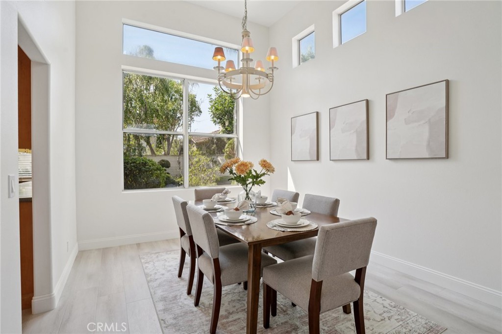 12440 Butler Way Tustin, CA 92782 - Photo 9 of 65 View of dining room from front entry. This area also looks out into the back yard with the kitchen entry on the left.