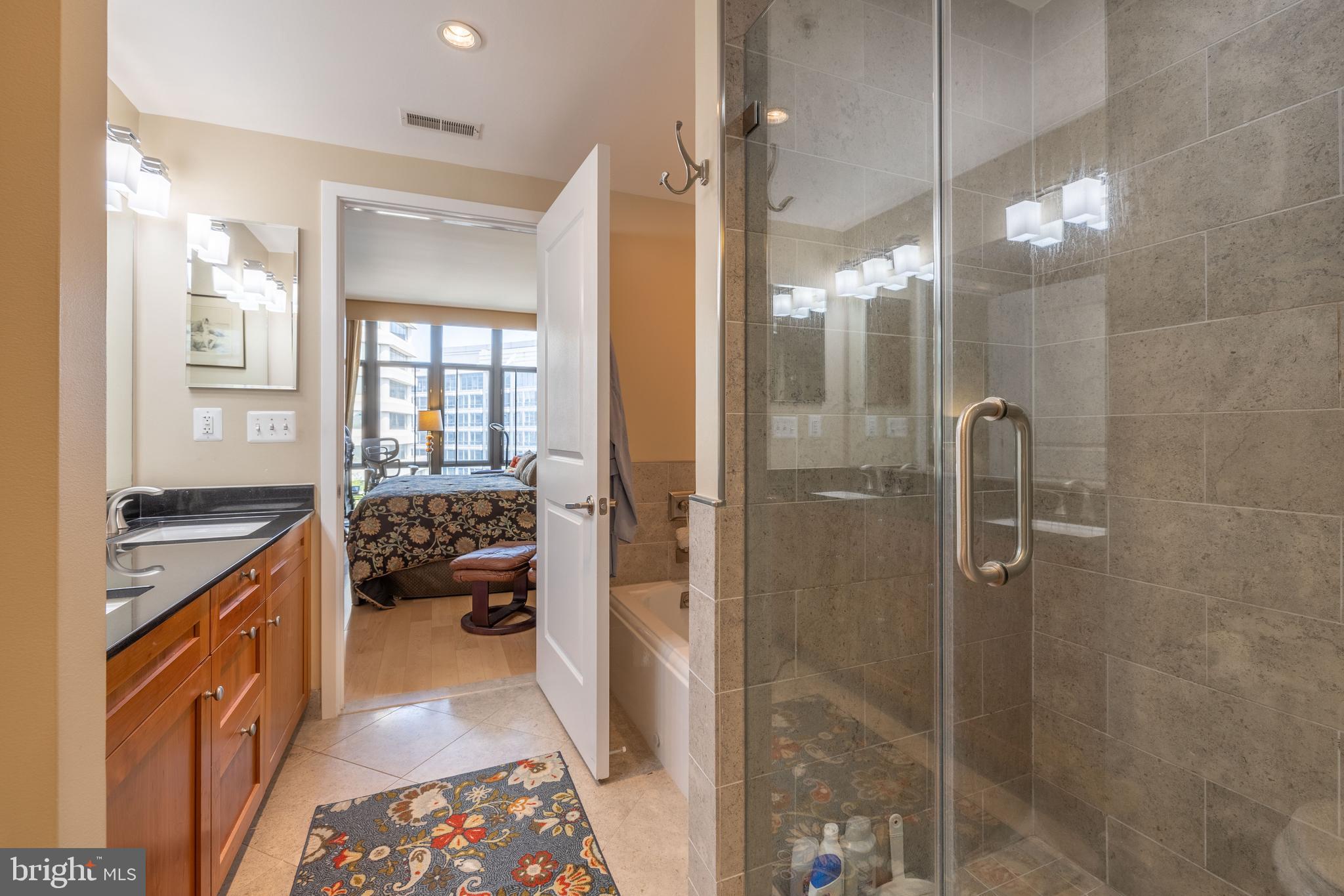 4301 Military Road Northwest, Unit 603 Washington, DC 20015 - Photo 18 of 35 Primary Bathroom w/ Soaking Tub and Walk-In Shower