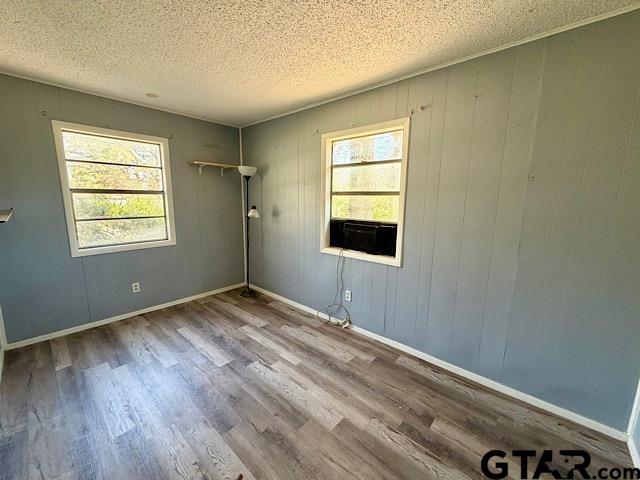 17159 County Road 1182 Flint, TX 75762 - Photo 12 of 29 a view of an empty room with wooden floor and a window