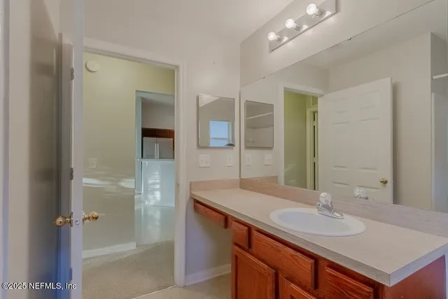 a bathroom with a sink and a mirror